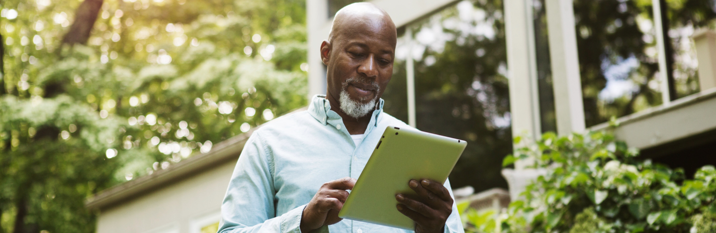 Man holding tablet device